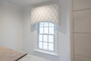 Louisville room with arched custom valance, sheer drapery, and soft light—crafted by top-rated Draped in Style.